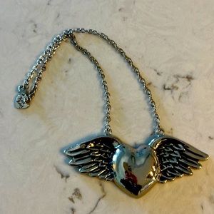Heart with wings!  Rock Rebel heart necklace on 8’inch chain! Heart is 5 x 2.